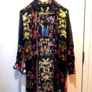 100% silk. Xllullan brand. Not sold currently. Colorful. floral. size Large